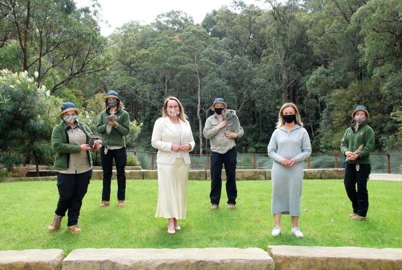 Lord Mayor Nuatali Nelmes and Cr Peta Winney-Baartz with Blackbutt staff members (L-R) Beth Woodhouse with Romeo the snake, Abbey Johnston with Carla the tawny frogmouth, Jemma Gosper with Kirra the koala and Abbie Ferris with Frida the frilled-neck lizard.