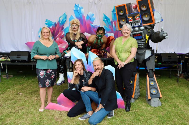 Newcastle Lord Mayor Nuatali Nelmes and Councillor Carol Duncan at The Hangar in Civic Park with Ella Heathmore and Zackari Watt (kneeling) from Fingers Crossed Creative and performers from the Intergalactic Sci-Fi Spectacular show.