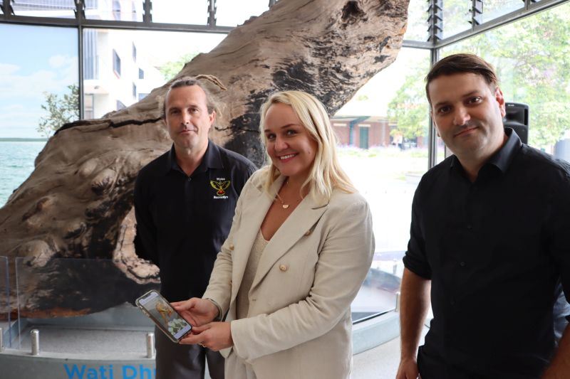 Guraki Aboriginal Advisory Committee member Luke Russell, Newcastle Lord Mayor Nuatali Nelmes and General Manager of VEARA Tim Davidson explore the augmented reality experience at the Nourishing Waters exhibition at Newcastle Museum on the first day of the New Annual festival.