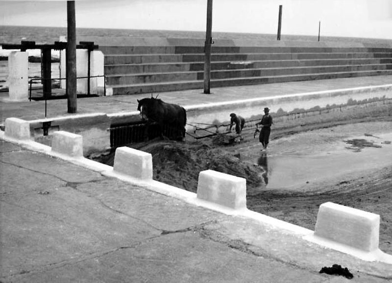 Removing sand at Newcastle Ocean Baths, 1953, Newcastle Libraries Hunter Photo Bank