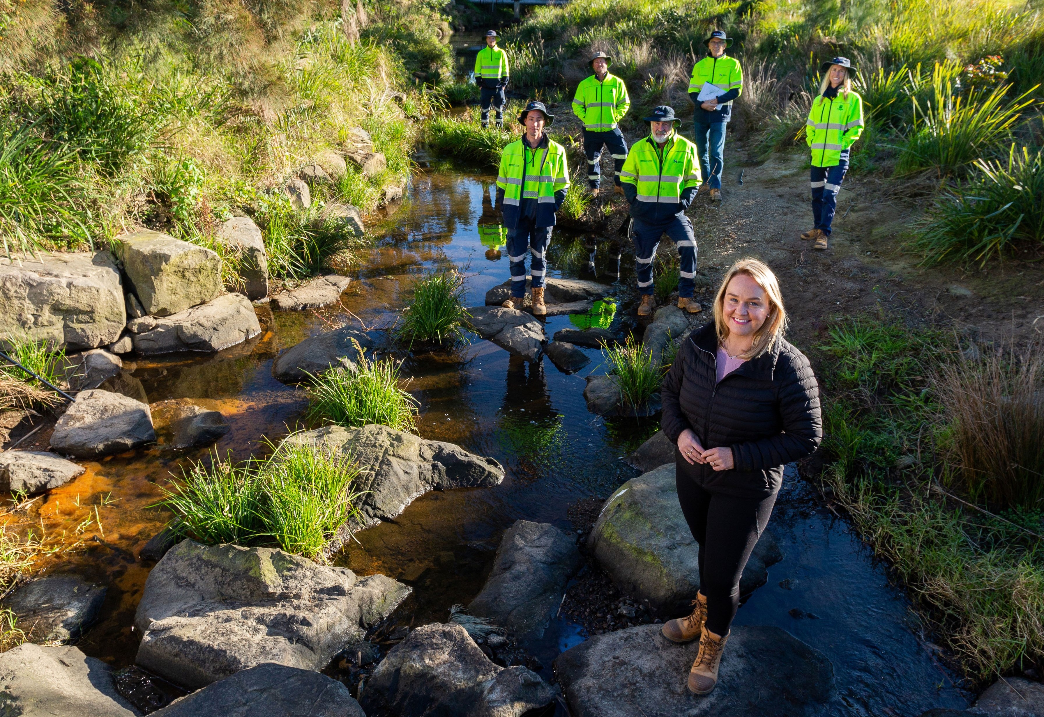 Lord-Mayor-Nuatali-Nelmes-with-City-of-Newcastle-staff-at-a-previously-rehabilitated-section-of-Ironbark-Creek.jpg