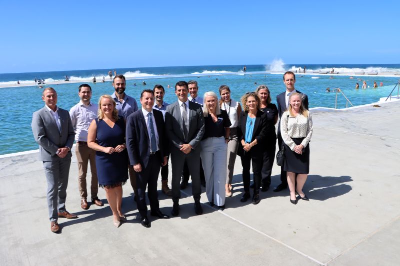 Lord Mayor Nuatali Nelmes, NSW Minister for Planning and Public Spaces Paul Scully, City of Newcastle CEO Jeremy Bath and City of Newcastle staff at the Newcastle Ocean Baths.