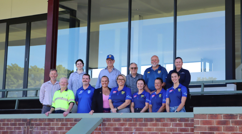 Lord Mayor Nuatali Nelmes joins CN staff, President of Hamilton Hawks Rugby Union Club Lesa Mason, Hawks players and officials, Hamilton-Wickham Cricket Club secretary Paul Rodgers and EJE Architecture representatives at the new-look Passmore Oval grandstand.