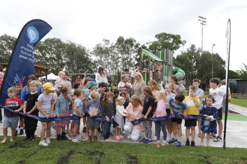 Lord Mayor Nuatali Nelmes and Councillor Peta Winney-Baartz join excited locals to officially open the new Adamstown Park playground.