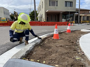Image of sandstone blocks being returned to frame key intersections along Mitchell Street
